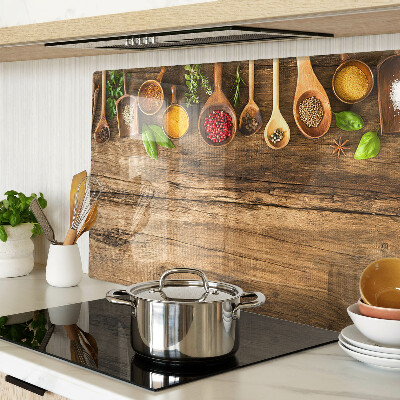 Glass kitchen board Spices and herbs on a wooden background