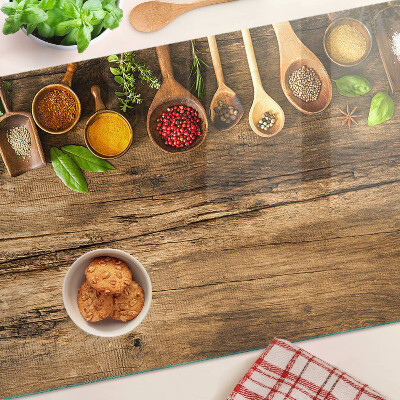 Glass kitchen board Spices and herbs on a wooden background