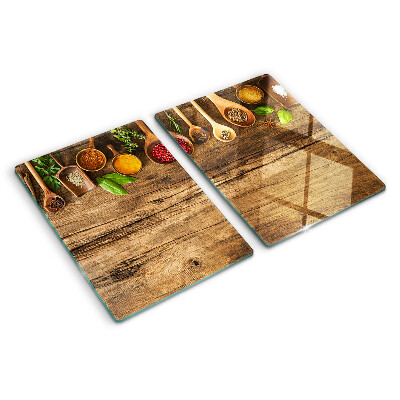 Glass kitchen board Spices and herbs on a wooden background