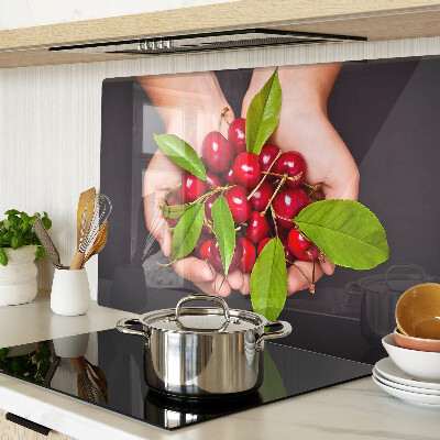 Chopping board Red cherries in hands
