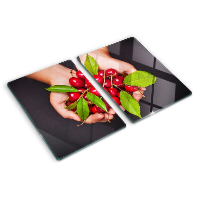 Chopping board Red cherries in hands