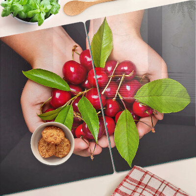 Chopping board Red cherries in hands