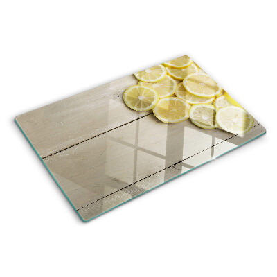 Cutting board Lemon slices on a wooden background