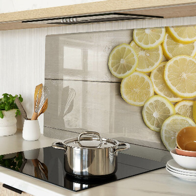 Cutting board Lemon slices on a wooden background