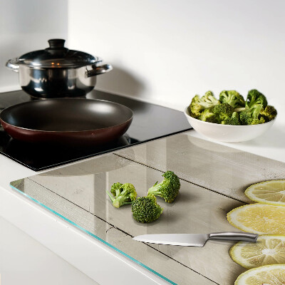 Cutting board Lemon slices on a wooden background
