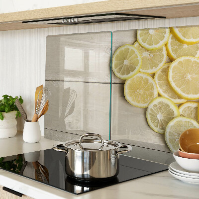 Cutting board Lemon slices on a wooden background