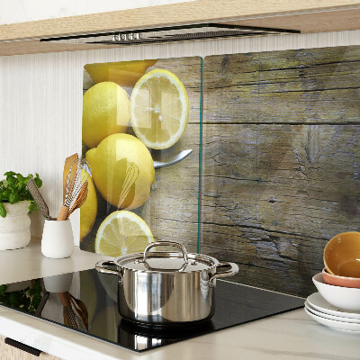 Cutting board Lemons on a wooden background
