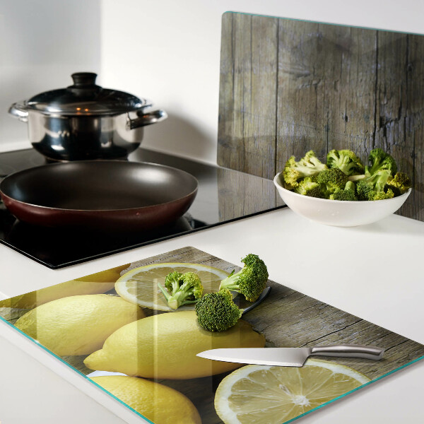 Cutting board Lemons on a wooden background