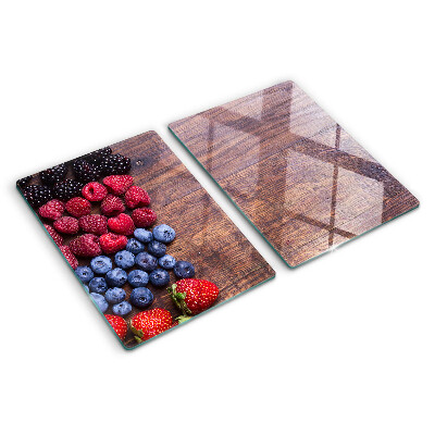 Chopping board Forest fruits on a wooden background