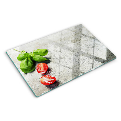 Glass chopping board Tomatoes with basil and salt