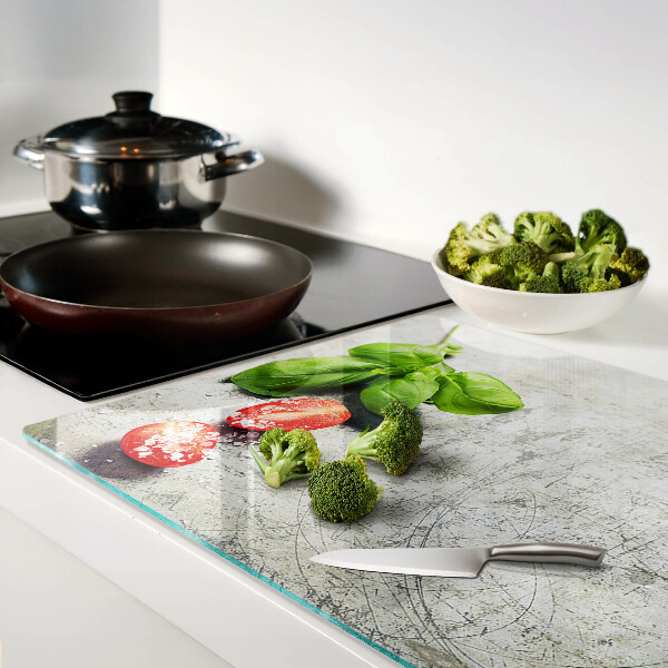 Glass chopping board Tomatoes with basil and salt
