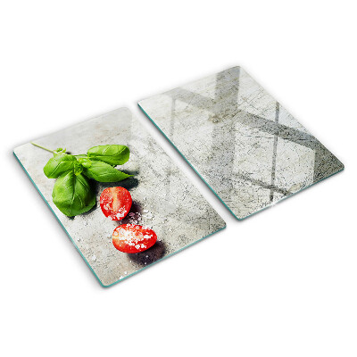 Glass chopping board Tomatoes with basil and salt