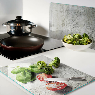 Glass chopping board Tomatoes with basil and salt