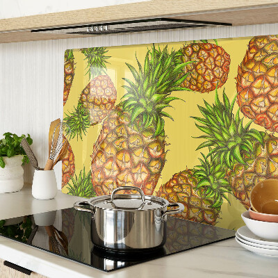 Glass kitchen board Pineapples on a yellow background