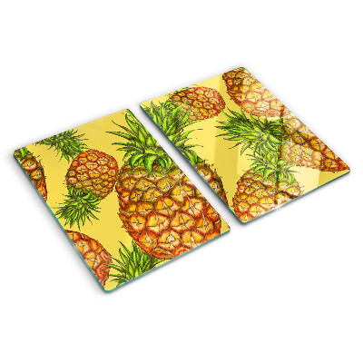 Glass kitchen board Pineapples on a yellow background