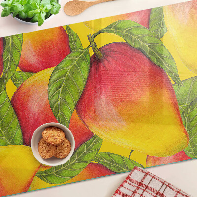 Chopping board glass Peppers on a background of green leaves