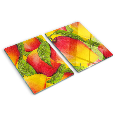 Chopping board glass Peppers on a background of green leaves