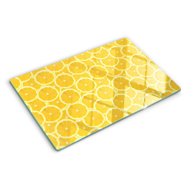 Glass kitchen board Lemon slices on a yellow background