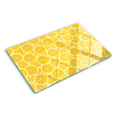 Glass kitchen board Lemon slices on a yellow background