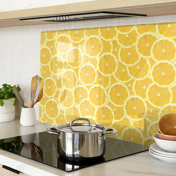 Glass kitchen board Lemon slices on a yellow background