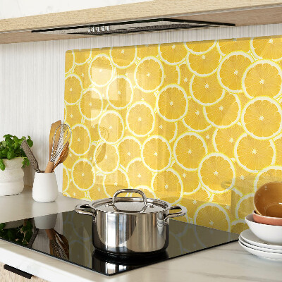 Glass kitchen board Lemon slices on a yellow background