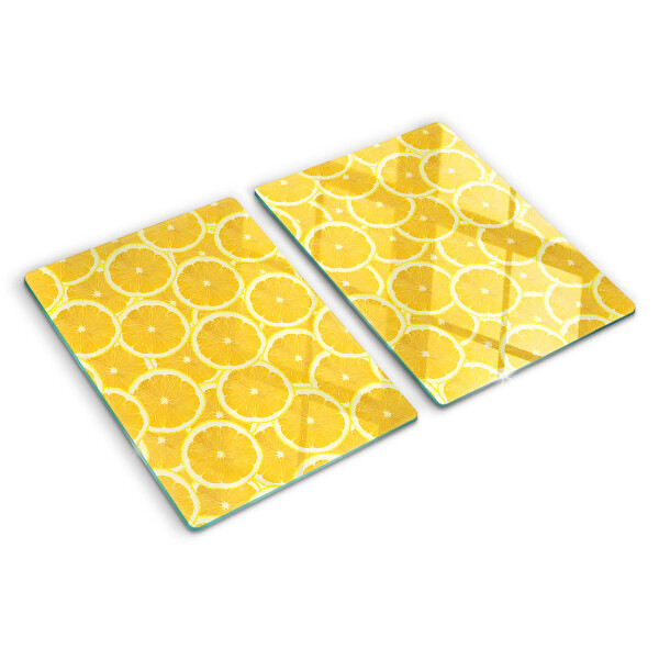 Glass kitchen board Lemon slices on a yellow background