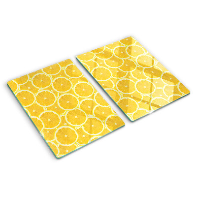 Glass kitchen board Lemon slices on a yellow background