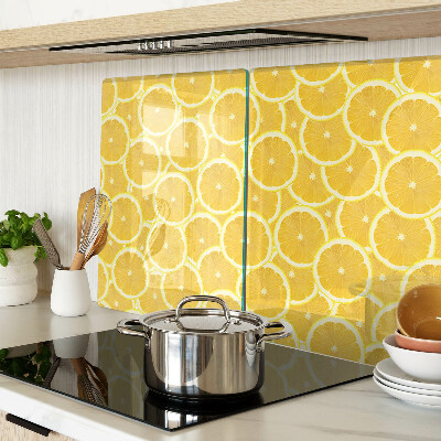 Glass kitchen board Lemon slices on a yellow background