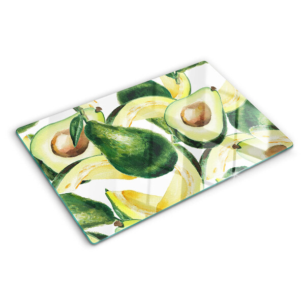 Glass cutting board Avocado with leaves in the background