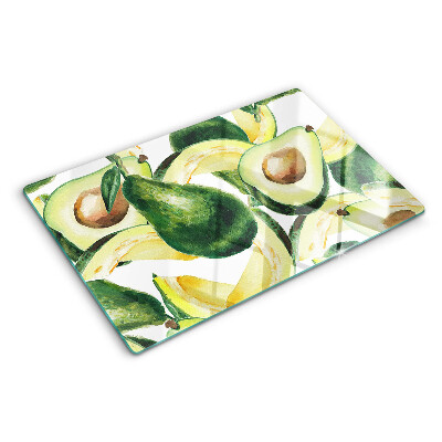 Glass cutting board Avocado with leaves in the background