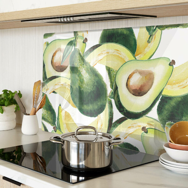 Glass cutting board Avocado with leaves in the background