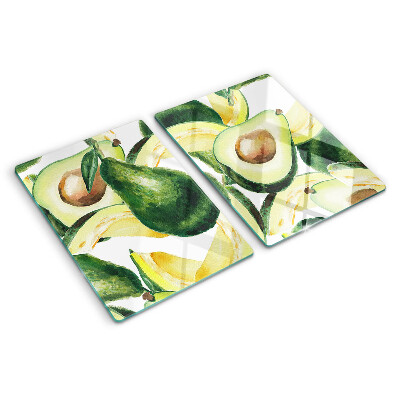 Glass cutting board Avocado with leaves in the background