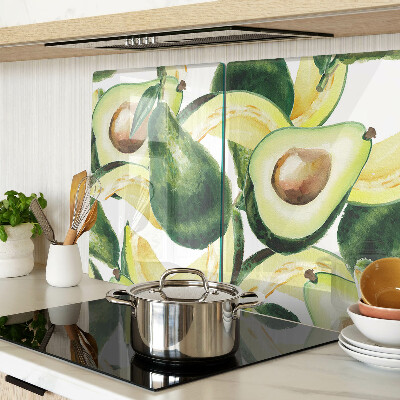 Glass cutting board Avocado with leaves in the background