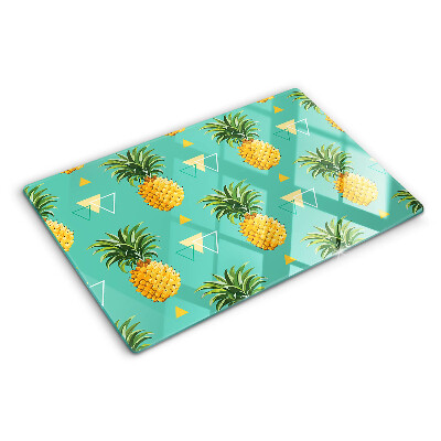 Chopping board glass Pineapples on a turquoise background
