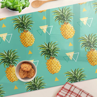 Chopping board glass Pineapples on a turquoise background