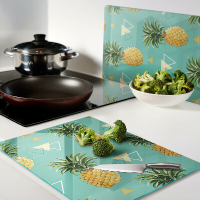 Chopping board glass Pineapples on a turquoise background