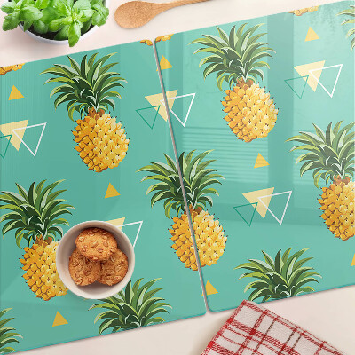 Chopping board glass Pineapples on a turquoise background