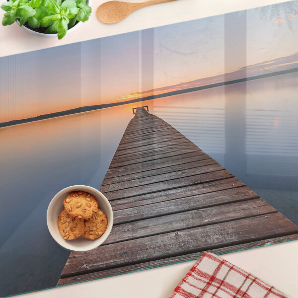 Chopping board Pier on the lake at sunset