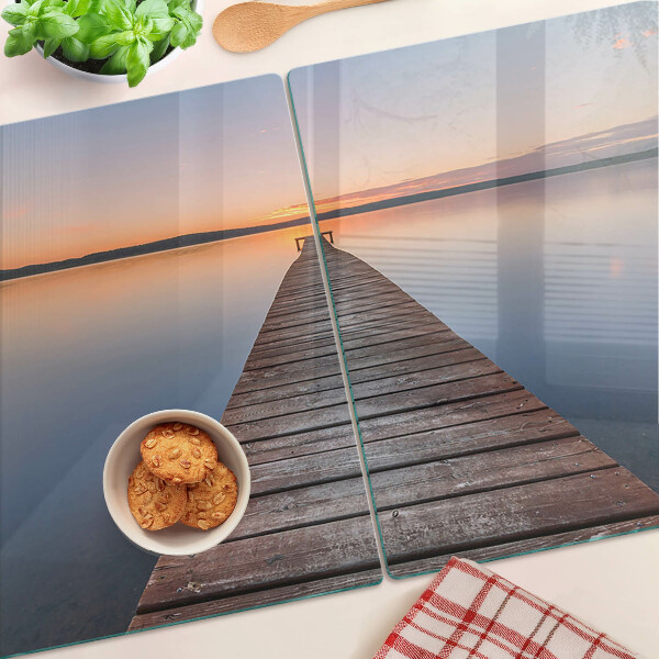 Chopping board Pier on the lake at sunset