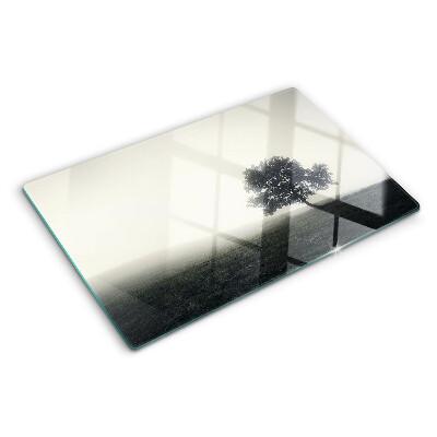Chopping board A tree in a foggy landscape