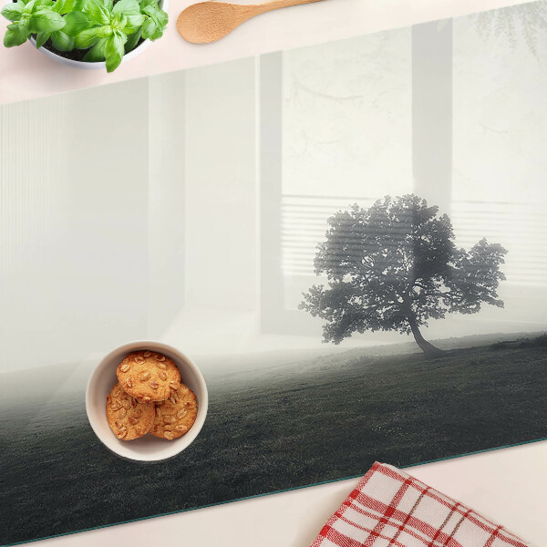Chopping board A tree in a foggy landscape