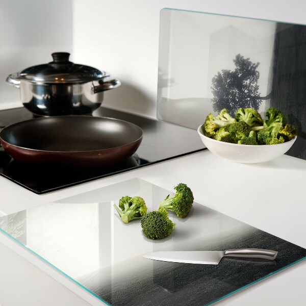 Chopping board A tree in a foggy landscape