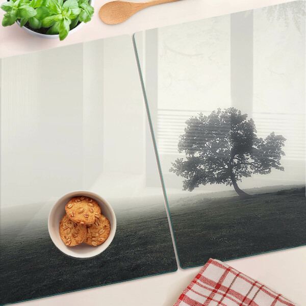 Chopping board A tree in a foggy landscape