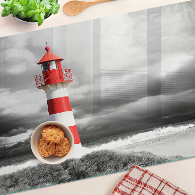 Glass chopping board A lighthouse in the landscape