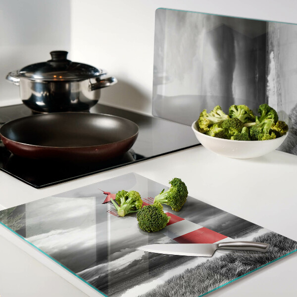 Glass chopping board A lighthouse in the landscape