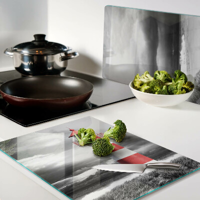 Glass chopping board A lighthouse in the landscape