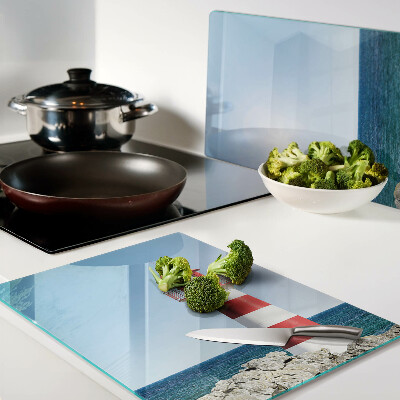 Glass cutting board A lighthouse over the ocean