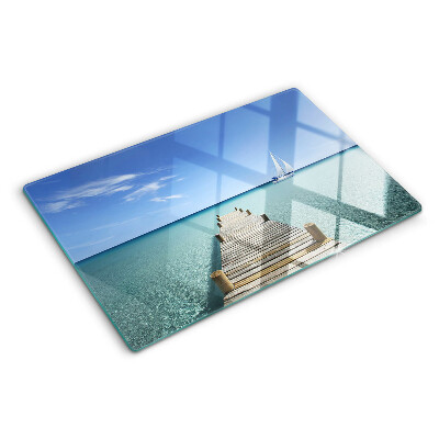 Glass kitchen board Pier over the turquoise sea