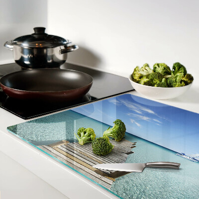 Glass kitchen board Pier over the turquoise sea