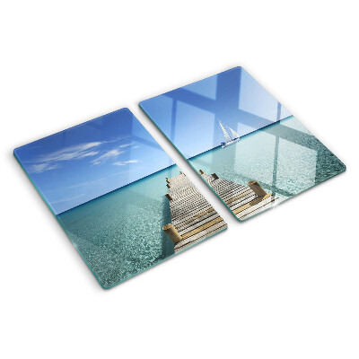 Glass kitchen board Pier over the turquoise sea
